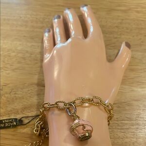 NWT’s- Avon Gold colored w/Pink perfume bottle Charm